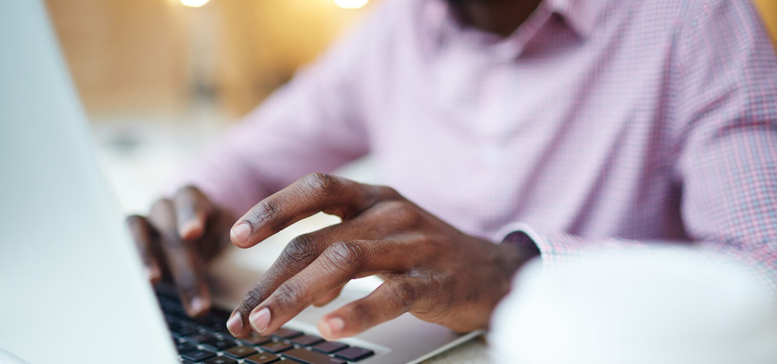 Hand typing on a keyboard