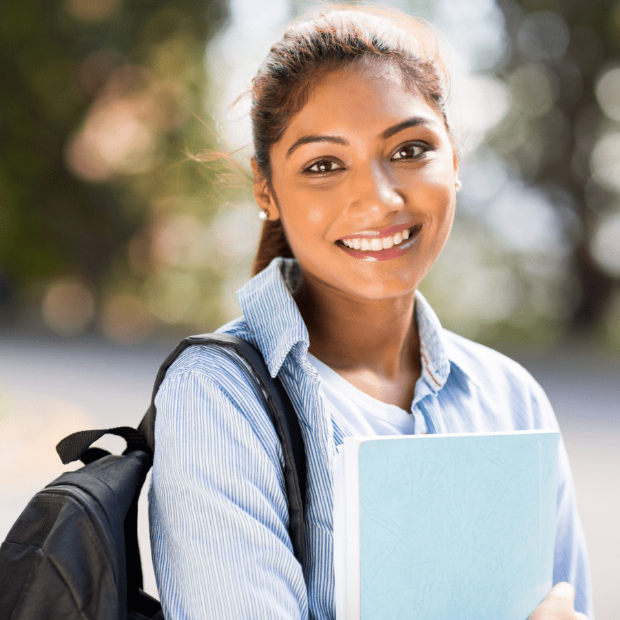woman-holding-folder-smiling-with-backpack
